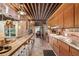 Eat-in kitchen with long breakfast bar, tile countertops and backsplash, with wood ceiling at 1016 Stearns Ave, Boulder, CO 80303