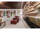 Stylish living area featuring a stone fireplace, wood ceilings, and ample natural light at 1016 Stearns Ave, Boulder, CO 80303