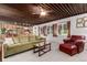 Spacious living room with wood ceilings, comfortable seating, and views into the dining area at 1016 Stearns Ave, Boulder, CO 80303
