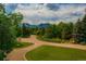 Scenic neighborhood view with winding roads, mature trees, and mountain backdrop at 1016 Stearns Ave, Boulder, CO 80303