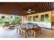 Inviting covered patio with ample seating, ceiling fan, and built-in cabinets for storage and entertaining at 1016 Stearns Ave, Boulder, CO 80303