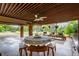 Spacious covered patio featuring a ceiling fan, ample seating, and views of the surrounding landscape at 1016 Stearns Ave, Boulder, CO 80303