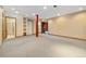 Basement features neutral carpet and columns at 30444 Ruby Ranch Rd, Evergreen, CO 80439