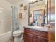 Full bathroom featuring a shower-tub combo and a vanity with a gray countertop at 30444 Ruby Ranch Rd, Evergreen, CO 80439