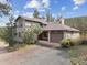 Charming two-story home with a two car garage, set back in a forest of pine trees at 30444 Ruby Ranch Rd, Evergreen, CO 80439