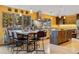 Open-concept kitchen featuring stainless steel appliances, an island, and modern pendant lighting at 30444 Ruby Ranch Rd, Evergreen, CO 80439