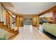 Open living room with hardwood floors, large windows, a staircase and view of the open-concept kitchen at 30444 Ruby Ranch Rd, Evergreen, CO 80439