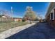 Spacious backyard with concrete patio and partial fencing at 8325 Elati St, Denver, CO 80221