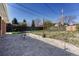 Spacious backyard with concrete patio and partial fencing at 8325 Elati St, Denver, CO 80221