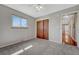 Neutral bedroom with closet, carpet, and natural light at 8325 Elati St, Denver, CO 80221