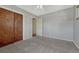 Comfortable bedroom with neutral tones, carpet, and natural light at 8325 Elati St, Denver, CO 80221