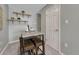 Small dining area includes modern table and stools at 8325 Elati St, Denver, CO 80221