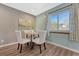 Bright dining room with a table, chairs, and a window at 8325 Elati St, Denver, CO 80221
