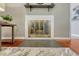 Close up of the fireplace with metallic door and tile hearth at 8325 Elati St, Denver, CO 80221