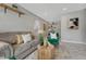 Well decorated living room with neutral color palette and shelves at 8325 Elati St, Denver, CO 80221