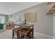Cozy living area featuring a modern table with stool seating, art, and an open floor plan at 8325 Elati St, Denver, CO 80221