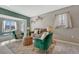 Inviting living room featuring comfortable seating and bright light from the bay window at 8325 Elati St, Denver, CO 80221