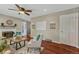 Bright living room features a fireplace, hardwood floors, and a modern ceiling fan at 8325 Elati St, Denver, CO 80221