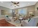 Comfortable living room with a fireplace, hardwood floors, and neutral decor at 8325 Elati St, Denver, CO 80221