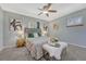 Charming main bedroom features a comfortable bed, stylish accents, and soft lighting at 8325 Elati St, Denver, CO 80221