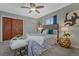 Comfortable main bedroom features a bed, lamps, and closet space at 8325 Elati St, Denver, CO 80221