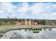 Scenic aerial view of a building next to water with the city skyline in the background at 3132 E 17Th Ave # B, Denver, CO 80206