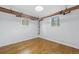Basement featuring wood floors and pipes at 3132 E 17Th Ave # B, Denver, CO 80206
