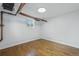 Basement featuring wood floors and pipes at 3132 E 17Th Ave # B, Denver, CO 80206