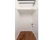 Spacious walk-in closet with custom shelving and wooden floors at 3132 E 17Th Ave # B, Denver, CO 80206
