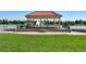 Scenic view of a gazebo, with surrounding green space and water creating a picturesque setting at 3132 E 17Th Ave # B, Denver, CO 80206