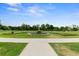 Beautiful park view with manicured flowerbeds and walking path on a sunny day at 3132 E 17Th Ave # B, Denver, CO 80206