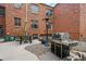 Brick patio featuring a built-in grill and seating area, perfect for outdoor dining and entertaining at 3132 E 17Th Ave # B, Denver, CO 80206