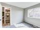 Bright bedroom with walk in closet, gray walls, plush carpet and ample light at 280 Birch St, Bennett, CO 80102