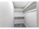 Walk-in closet with built-in shelving and ample storage space at 280 Birch St, Bennett, CO 80102