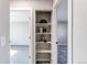 Hallway featuring built-in shelving between two doorways, carpet, and modern paint at 280 Birch St, Bennett, CO 80102