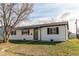 Exterior front view of this cozy, one-story home with nice yard at 280 Birch St, Bennett, CO 80102