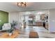 Living room, kitchen and bedroom showcasing an open floor plan and bright sunlight at 280 Birch St, Bennett, CO 80102