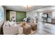 Living room, kitchen and bedroom showcasing an open floor plan at 280 Birch St, Bennett, CO 80102