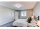 Well-lit main bedroom with soft carpet, stylish furnishings, and ample natural light at 280 Birch St, Bennett, CO 80102
