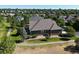 Aerial view of a home with a well manicured lawn, landscaping and private backyard at 6699 S Robb St, Littleton, CO 80127