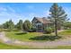Expansive backyard showcasing a well-maintained lawn, mature trees, and private setting at 6699 S Robb St, Littleton, CO 80127