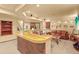 Basement bar and entertainment area featuring two sofas, bar and game table at 6699 S Robb St, Littleton, CO 80127