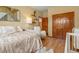 This cozy bedroom features hardwood floors, modern decor, and ample closet space at 6699 S Robb St, Littleton, CO 80127