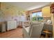 Well-lit Bedroom with daybed, pastel floral wall design and large window at 6699 S Robb St, Littleton, CO 80127