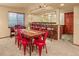 Dining Area features a wet bar, unique chairs and table, and a light fixture at 6699 S Robb St, Littleton, CO 80127