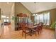 Formal dining room with hardwood floors, chandelier, and space for a large dining table at 6699 S Robb St, Littleton, CO 80127