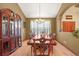 Formal dining room with hardwood floors, chandelier, and space for a large dining table at 6699 S Robb St, Littleton, CO 80127