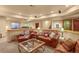 A cozy living room features comfortable leather seating and a stylish coffee table at 6699 S Robb St, Littleton, CO 80127