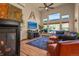 Comfortable living room with cozy fireplace, large windows, and stylish decor for relaxation and enjoyment at 6699 S Robb St, Littleton, CO 80127