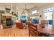 Living room with fireplace, vaulted ceilings, modern decor, and natural light creates a spacious living space at 6699 S Robb St, Littleton, CO 80127